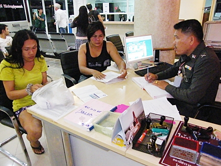 Pornkaran Sumrum and Phaisan Chanthok file a report with police.